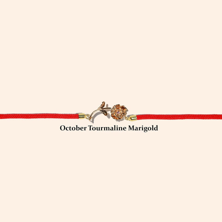 Rote Armbänder mit Geburtsblumen und Geburtssteinen